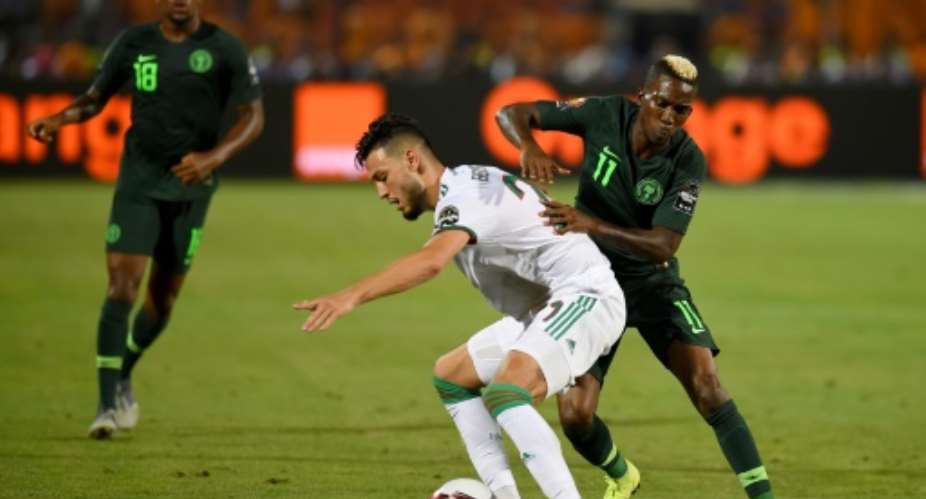 Nigeria's forward Henry Onyekuru R -- shown in a match against Algeria during the 2019 Africa Cup of Nations CAN -- has been signed by AS Monaco.  By MOHAMED EL-SHAHED AFPFile