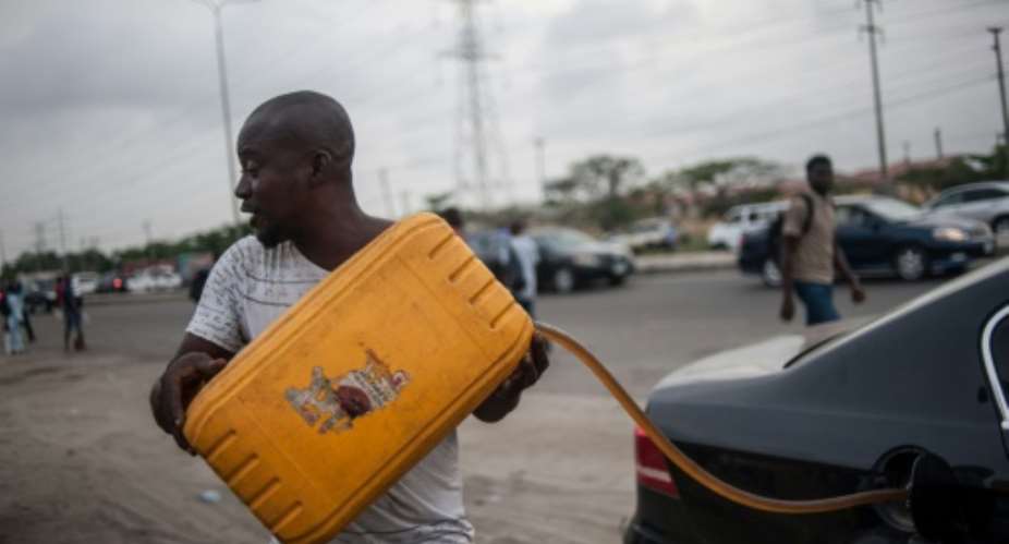 Nigeria's fuel subsidy bill has spiked and as February elections approach, questions are being asked about the government's management of oil sales and earnings.  By STEFAN HEUNIS AFP