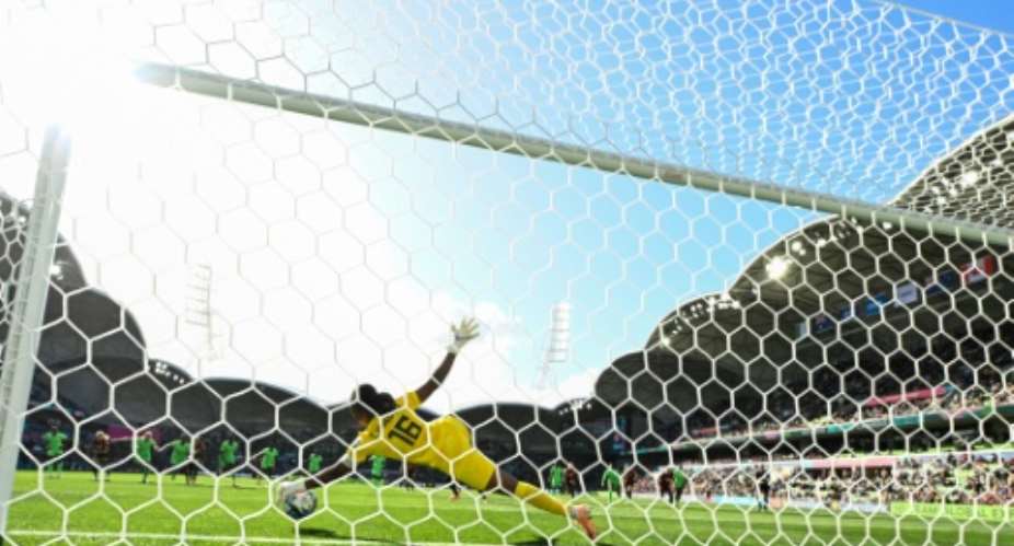 Nigeria's goalkeeper Chiamaka Nnadozie saves a penalty from Canada's Christine Sinclair.  By WILLIAM WEST AFP