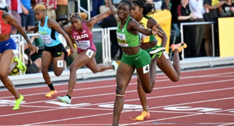 Nigeria's Tobi Amusan storms to victory in the women's 100m hurdles.  By ANDREJ ISAKOVIC AFP