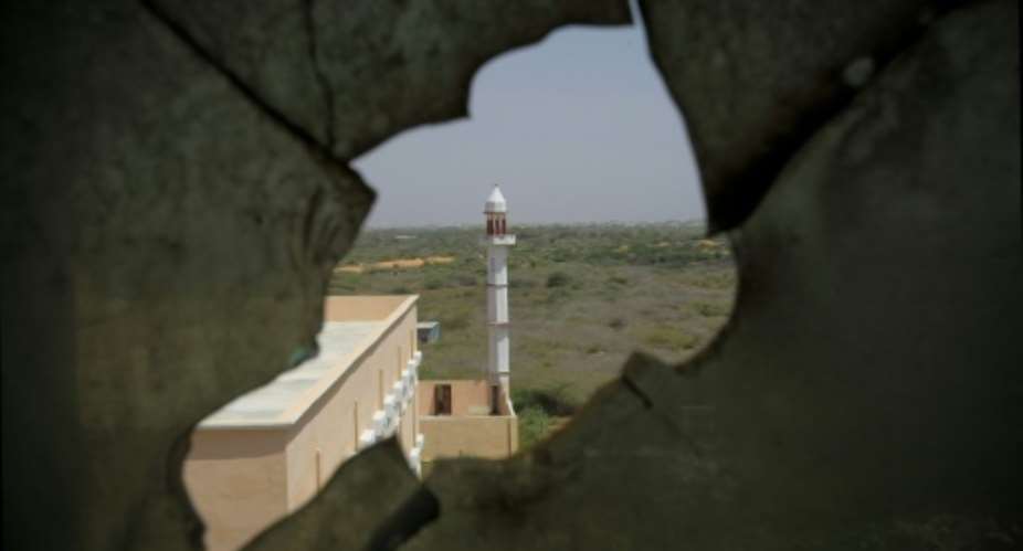 A mosque pictured through a broken window from inside Mogadishu University on January 23, 2012.  By Stuart Price AU-UN ISTAFPFile