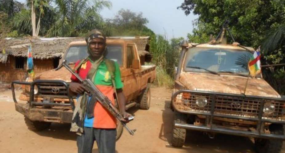 Seleka rebels patrol a road near the Central African Republic city of Damara on January 8, 2013.  By  (AFP/File)