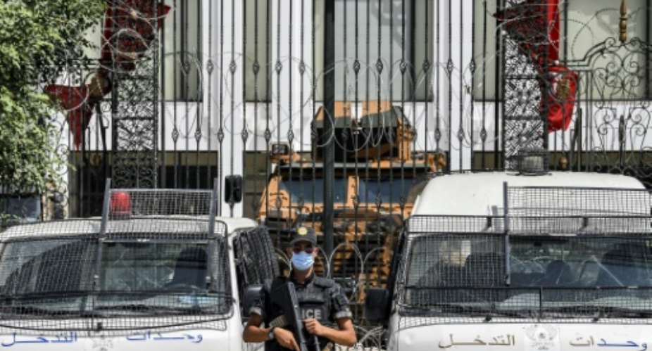 No entry: an armoured car and security forces stand guard outside parliament in Tunis on July 31, 2021.  By FETHI BELAID AFP