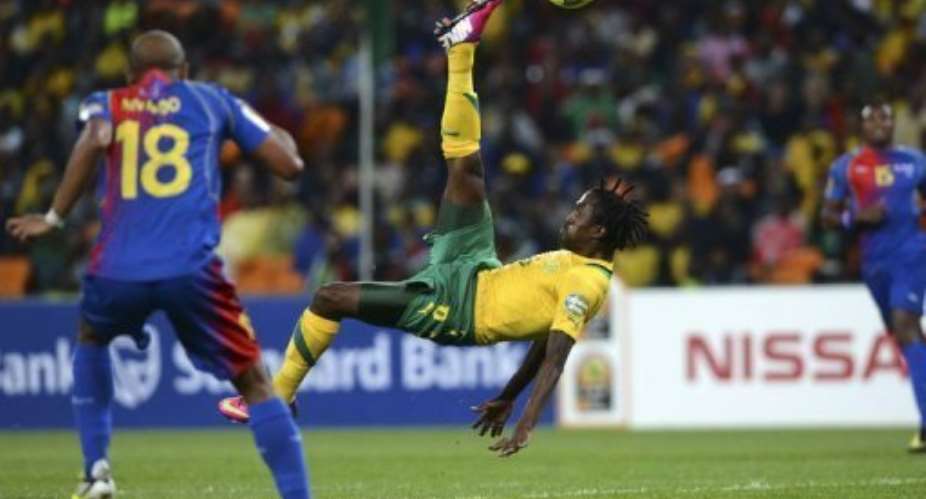 South Africa midfielder Lerato Chabangu tries an overhead kick on January 19, 2013.  By Francisco Leong AFP