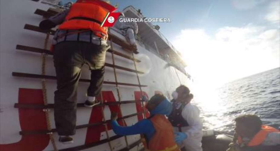 Italian coastguards rescue migrants off the coast of Sicily, on April 12, 2015.  By  Guardia CostieraAFPFile