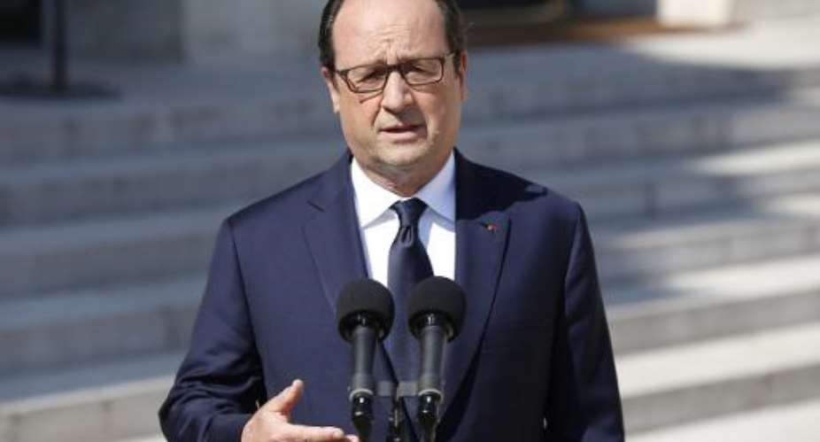 French President Francois Hollande speaks to the press at the Elysee Palace in Paris on July 25, 2014, a day after an Air Algerie plane with 116 passengers on board crashed in Mali, near the Burkina Faso border.  By Kenzo Tribouillard AFP