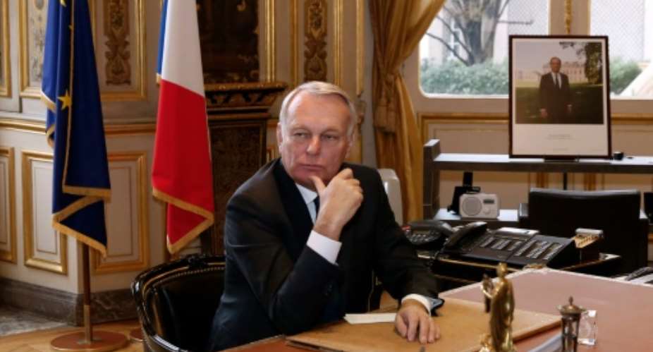 Newly appointed French Foreign Minister Jean-Marc Ayrault at his desk at the Foreign Ministry, on February 12, 2016 in Paris.  By Patrick Kovarik PoolAFPFile