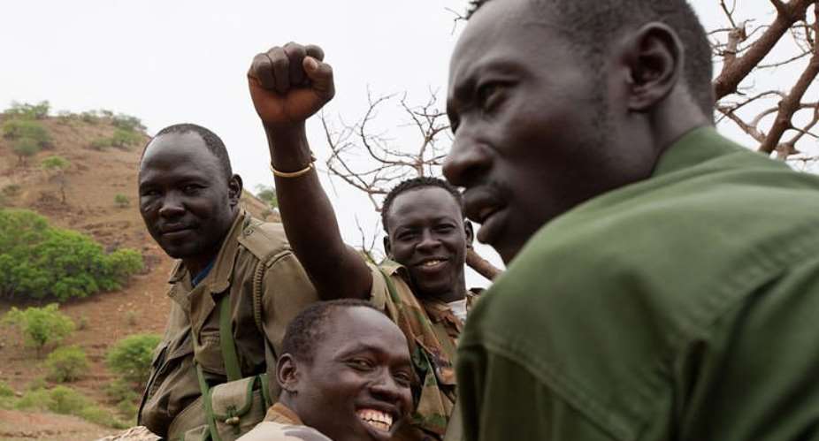 Soldiers of Sudan Peoples Liberation Movements northern arm (SPLM) drive through the Nuba mountains of South Kordofan.  By Phil Moore (AFP)