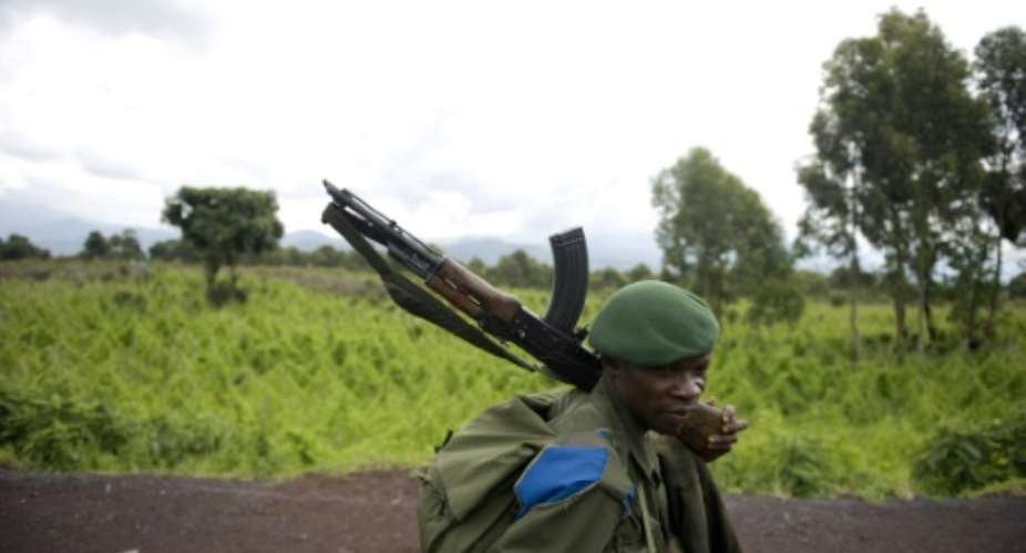 North Kivu, one of the most populated areas of the DRC and where a soldier is seen in 2008, is home to a number of armed groups that kill or abduct civilians.  By WALTER ASTRADA AFPFile