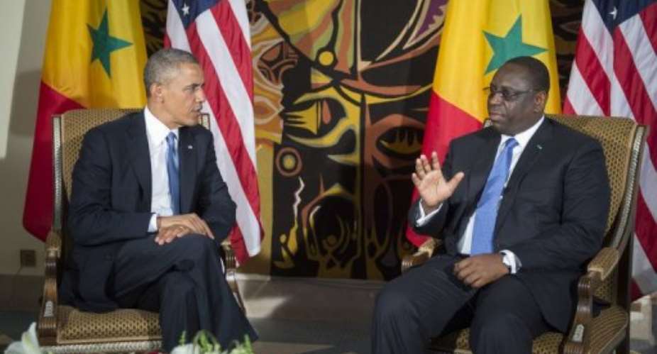 Barack Obama left talks with Macky Sall during a bilateral meeting in Dakar on June 27, 2013.  By Jim Watson AFP