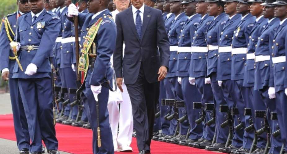 US President Barack Obama inspects a guard of honour on July 25, 2015 at the State House in Nairobi.  By Simon Maina AFP