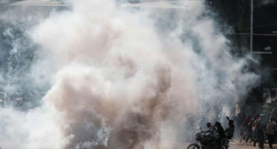 Officers fired tear gas at demonstrators in the capital Nairobi.  By Yasuyoshi CHIBA AFP