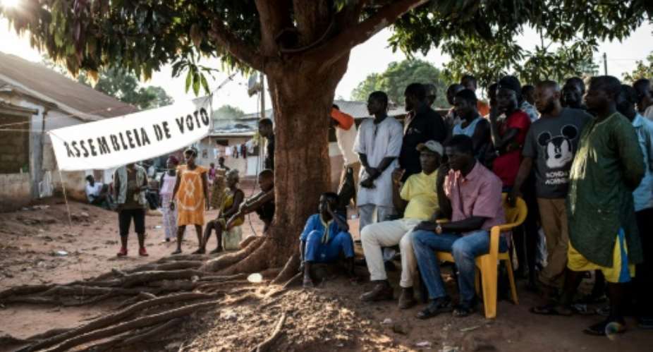 Officials count first-round votes at a polling station in the popular Bairro Militar area of Bissau in November 2019.  By JOHN WESSELS AFPFile