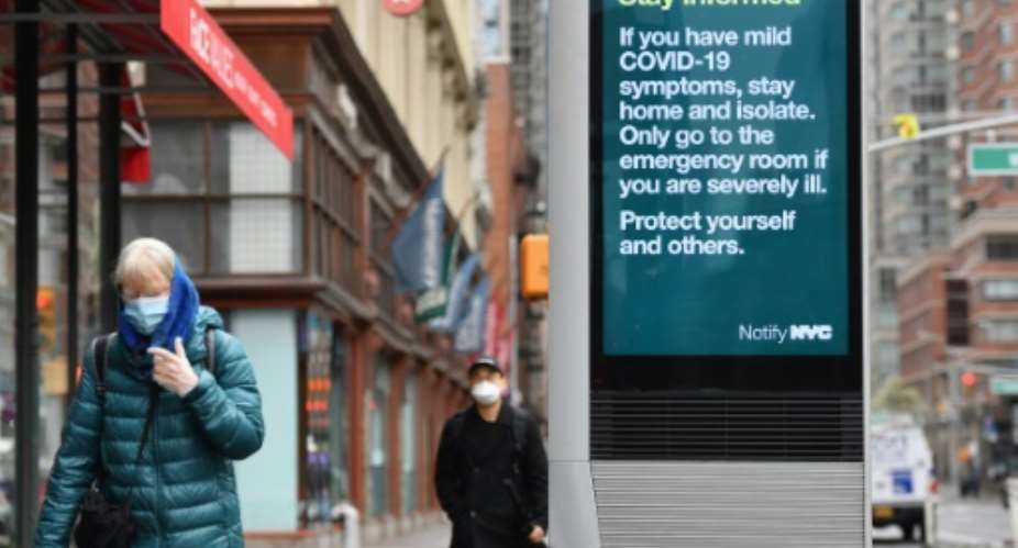 Officials in New York, the worst affected part of the US, began advising people to wear masks some days ago, and there were signs on the streets that the advice was being heeded.  By Angela Weiss AFP
