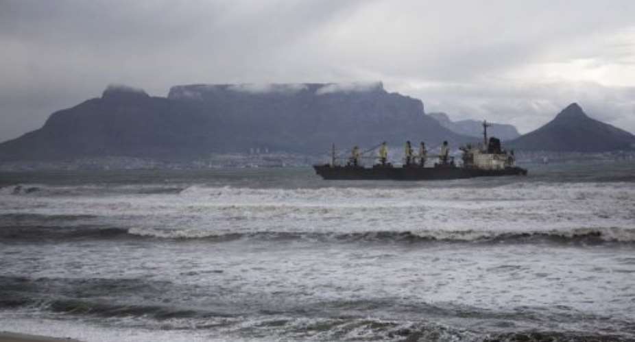 A bulk carrier sits after running aground in 2009 in front of the Table Bay beach.  By  AFPFile