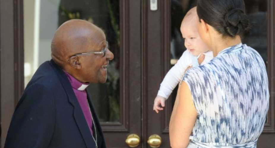 Old and young: The Archbishop and Archie.  By HENK KRUGER POOLAFP
