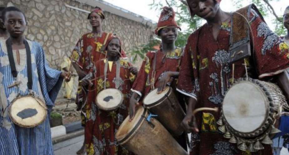 The West African talking drum once served as a means of communication long before phones.  By Pius Utomi Ekpei (AFP/File)