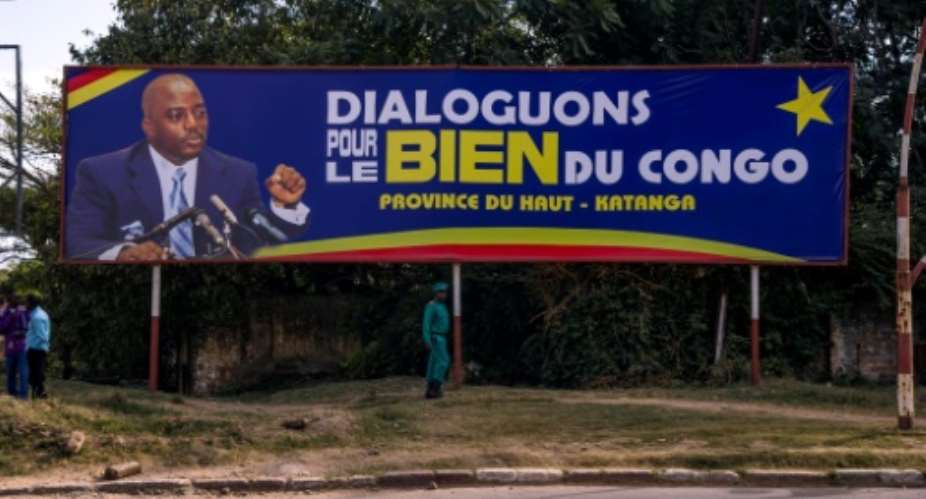 On a billboard in Lubumbashi, President Joseph Kabila urges Lets talk for the good of the Congo.  By Junior Kannah (AFP)