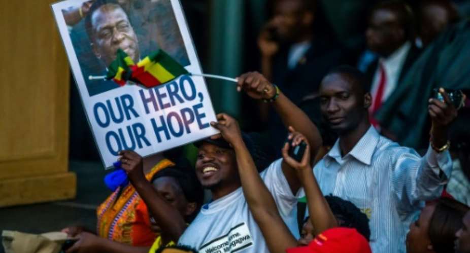 On arrival back in Harare, Emmerson Mnangagwa was treated to a hero's welcome ahead of his inauguration as Zimbabwe's president on Friday.  By Jekesai NJIKIZANA AFP