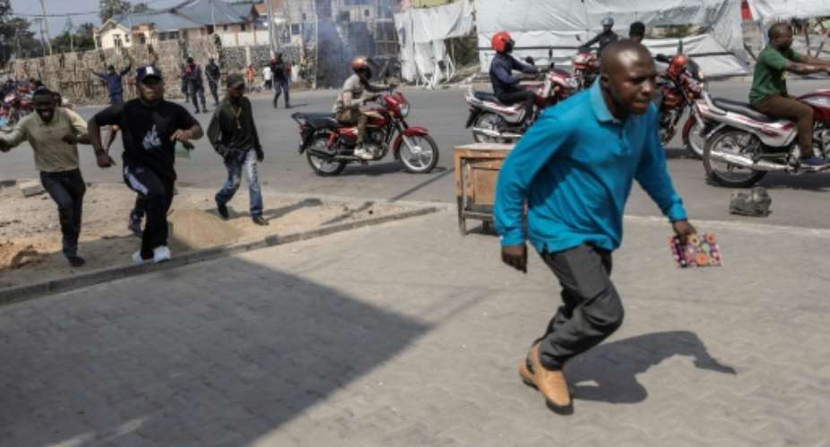 On arrival in Goma city centre, the march was stopped by police who fired tear gas.  By Guerchom Ndebo AFP