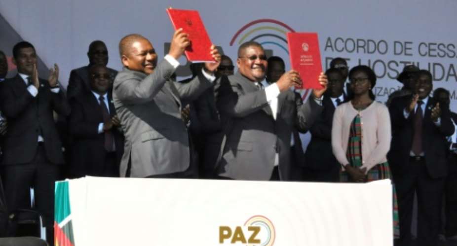 On August 1, President Filipe Nyusi, left, and Renamo leader Ossufo Momade signed a precursor pact to end military hostilities.  By Stringer Office of the President of MozambiqueAFPFile