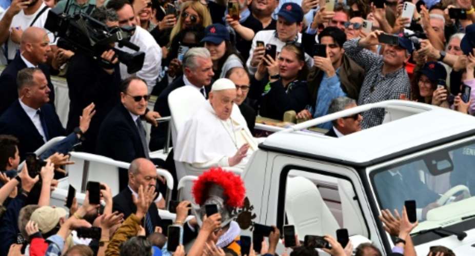 On Sunday, Pope Francis greeted the crowd in St Peters Square after Easter mass.  By Tiziana FABI (AFP)