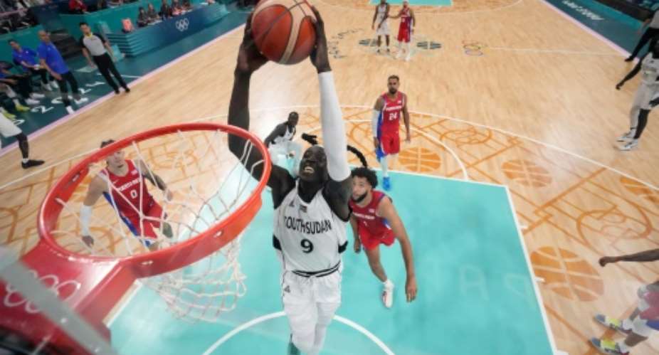 On the rise - Wenyen Gabriel dunks for South Sudan aganst Puerto Rico.  By - (POOL/AFP)