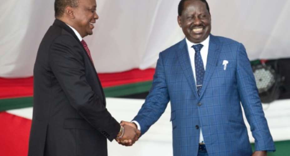Once were rivals: President Uhuru Kenyatta, left, and opposition leader Raila Odinga at an annual prayer breakfast for national unity in May 2018..  By Evans OUMA AFP