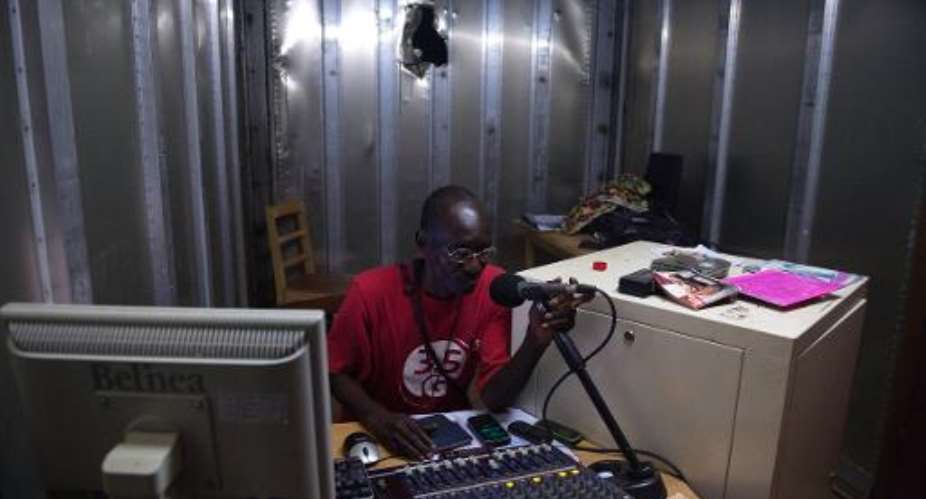 Philemon Tchang Peuty Palou, a journalist working for the radio 'Be-Oko', in his office in Bambari, Central African Republic, on April 19, 2014.  By Miguel Medina AFPFile