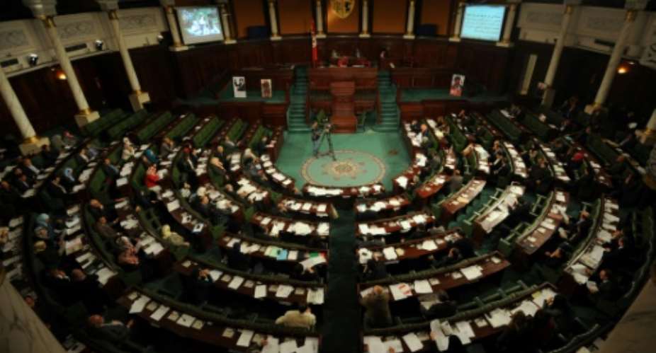 One hundred and forty-five lawmakers out of 217 voted to pass the 36-article law, which criminalises any retribution against whistleblowers including any disciplinary measures against civil servants.  By FETHI BELAID AFPFile