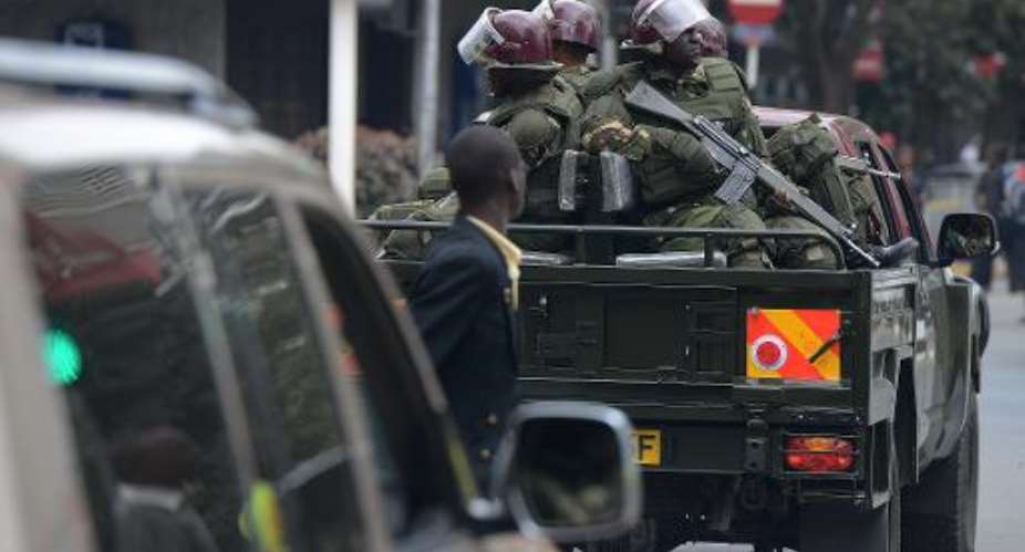 Kenyan anti-riot police beef up security on July 7, 2014 for an opposition rally in Nairobi amid mounting unrest in the country.  By Simon Maina AFPFile