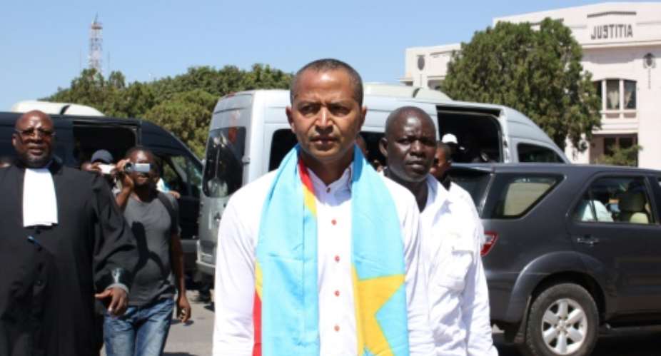 Opposition figure Moise Katumbi C arrives at the courthouse in Lubumbashi on May 13, 2016.  By FISTON MAHAMBA AFPFile