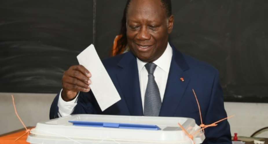 Ivorian President Alassane Ouattara casts his ballot in Cocody, a district of Abidjan, on October 25, 2015.  By Sia Kambou AFPFile