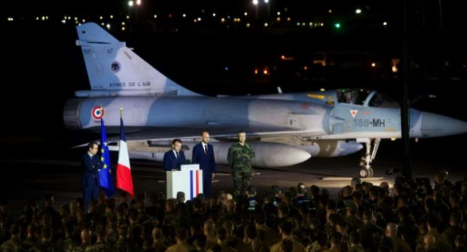 Our role is changing in Africa, Macron told French troops in Djibouti.  By Nicolas MESSYASZ (POOL/AFP)