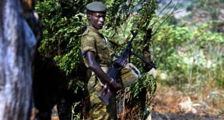 A Burundian soldier patrols the perimeter of the southern district of Musaga in Bujumbura.  By Marco Longari AFPFile