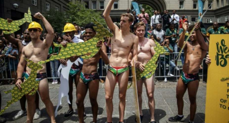 Overboard underwear: Springbok supporters wear South African flag speedos to mimic Springbok scrumhalf Faf de Klerk's attire.  By Michele Spatari AFPFile