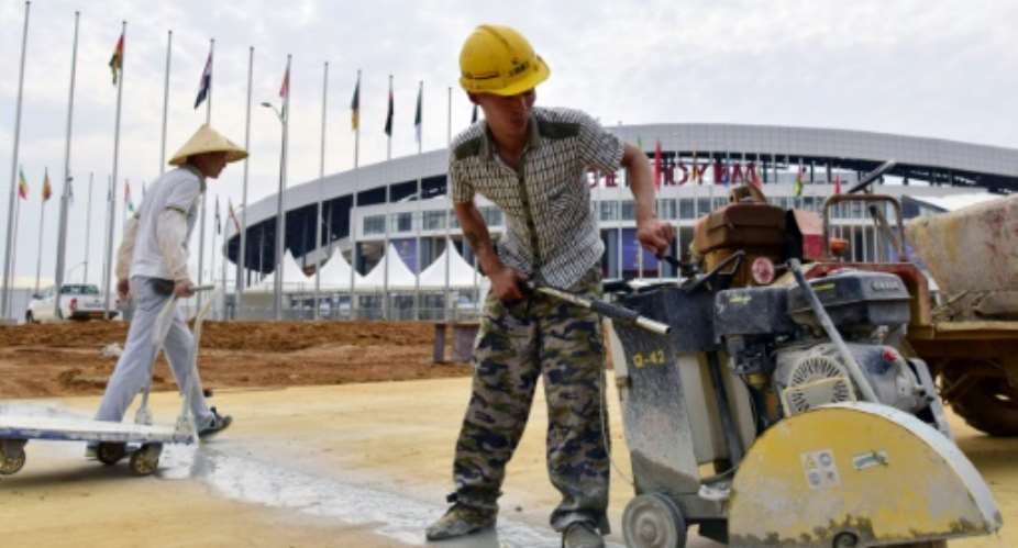 Oyem stadium's setting is remarkable but  Chinese construction workers were still putting the finishing touches to the venue while Africa Cup of Nations games went on.  By ISSOUF SANOGO AFPFile