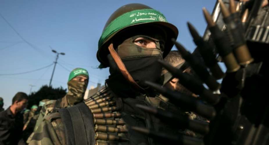 Palestinian members of the al-Qassam Brigades, the armed wing of the Hamas movement, take part in a anti-Israel military parade in Rafah in the southern Gaza Strip, on August 21, 2016.  By Said Khatib AFPFile