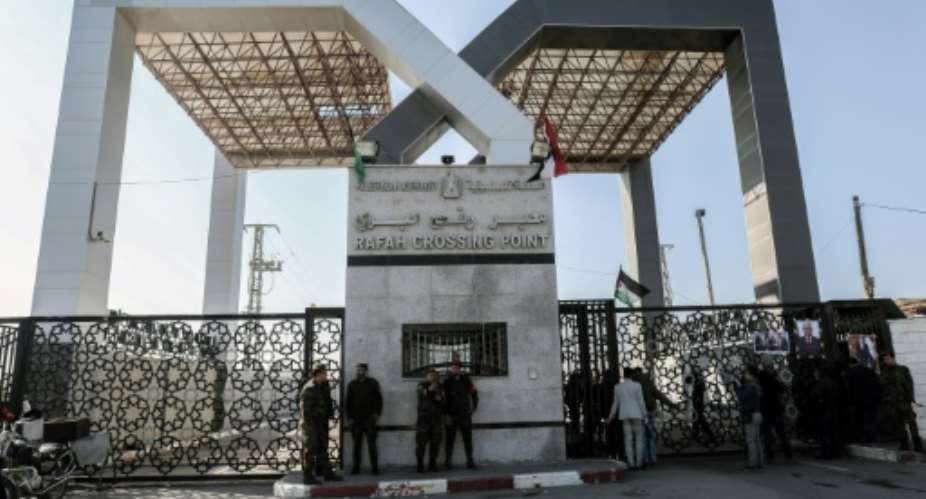 Palestinian security forces loyal to Hamas stand guard outside the Rafah border crossing with Egypt, under the control of the Palestinian Authority, on December 16, 2017.  By SAID KHATIB AFPFile
