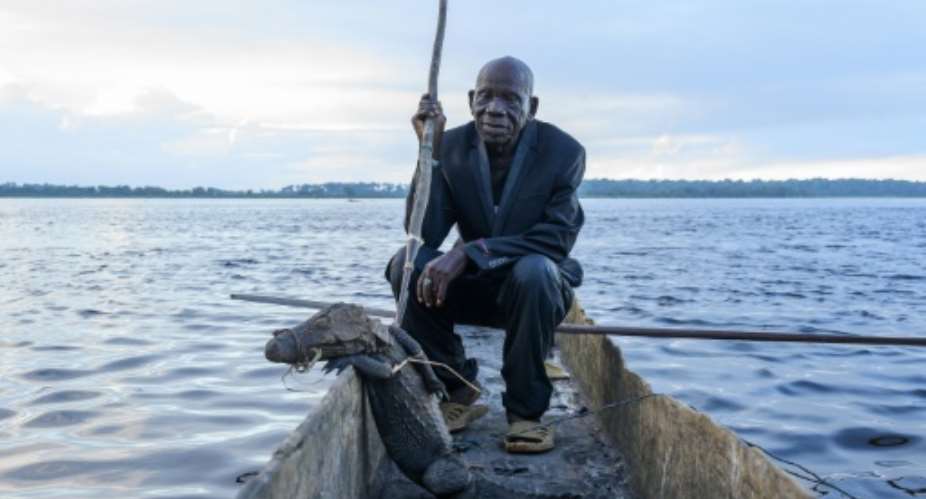 Papa Baron Missiki, 91, talks of his days hunting crocodiles on the Congo River.  By Arsene Mpiana AFP