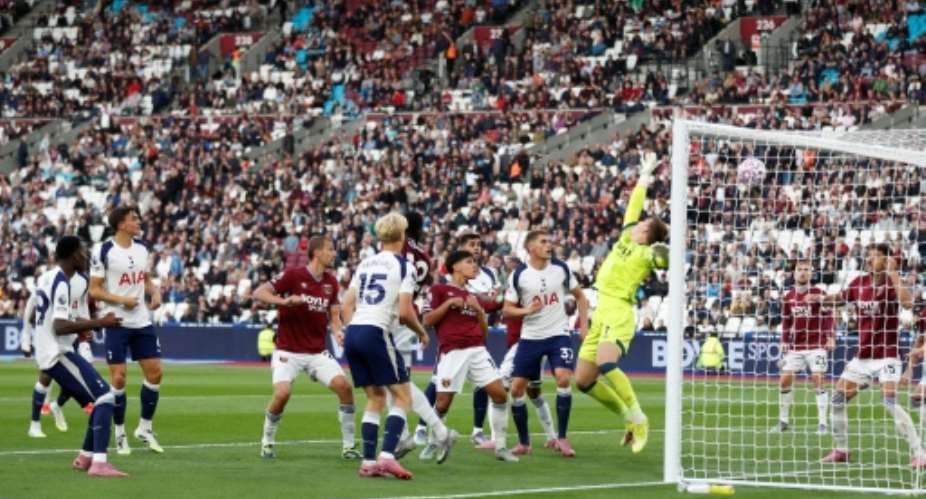 Pape Matar Sarr (L) scores for Tottenham Hotspur against West Ham United..  By Ian Kington (AFP)