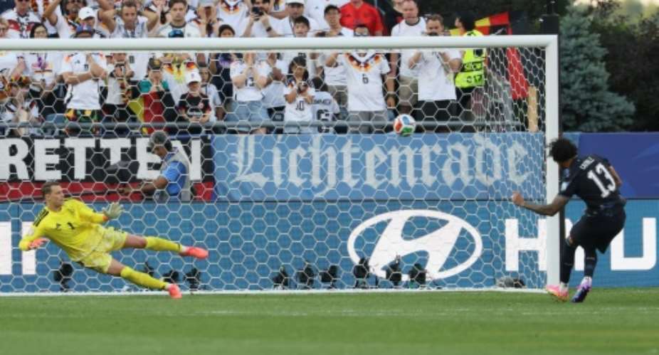 Paraguays Jose Canale sends Germany goalkeeper Manuel Neuer the wrong way to clinch victory in a penalty shoot-out as the South Americans reach the last 16.  By Odd ANDERSEN (AFP)