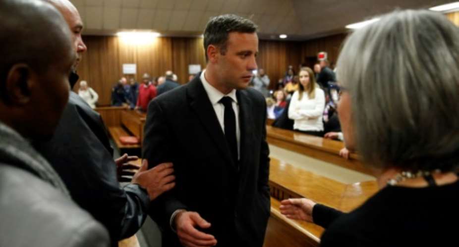 Paralympian athlete Oscar Pistorius, seen following his sentencing, became eligible for parole in July after serving half his 13-year term.  By MARCO LONGARI POOLAFP