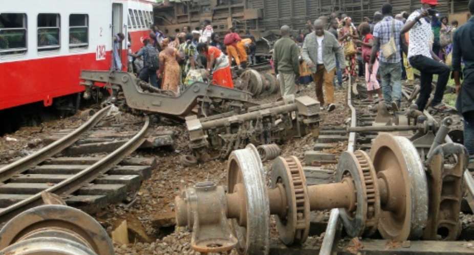 Passengers escape the site of a train derailment in Eseka, Cameroon, which left at least 60 dead and 575 injured.  By  AFPFile