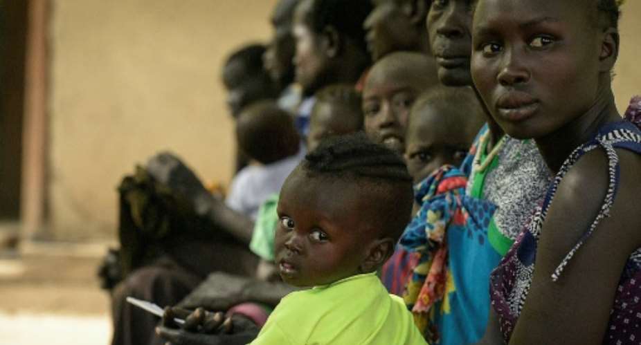 Patients wait for treatment at the Udier primary health and care center supported by the International Committee of the Red Cross ICRC in Udier, in the Upper Nile region, of South Sudan.  By SIMON MAINA AFP