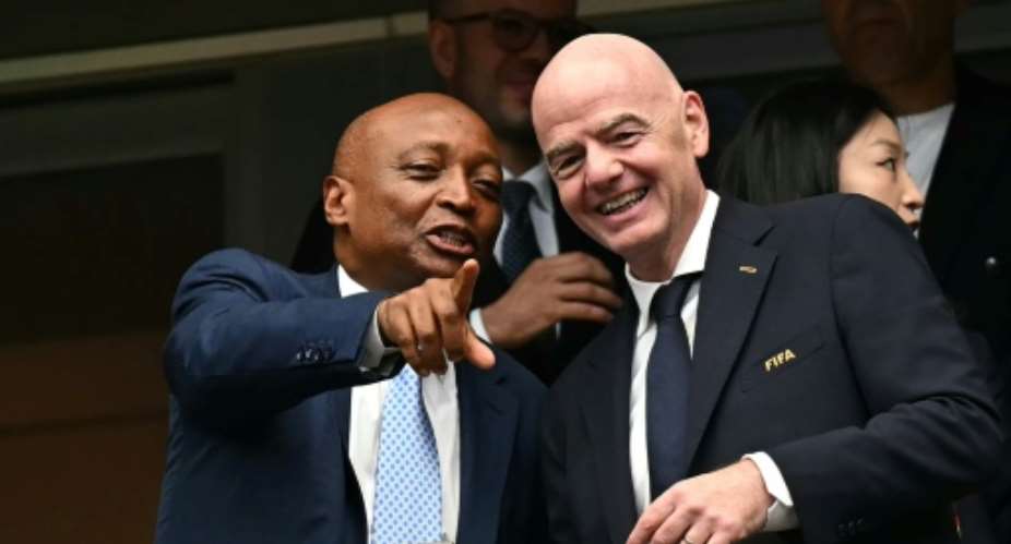 Patrice Motsepe (left) said Gianni Infantino had remained loyal to Africa.  By Paul ELLIS (AFP/File)