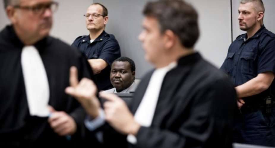 Patrice-Edouard Ngaissona, pictured centre in 2019, is on trial in The Hague for war crimes as many victims in Central African Republic hope for justice.  By Koen van Weel POOLAFPFile