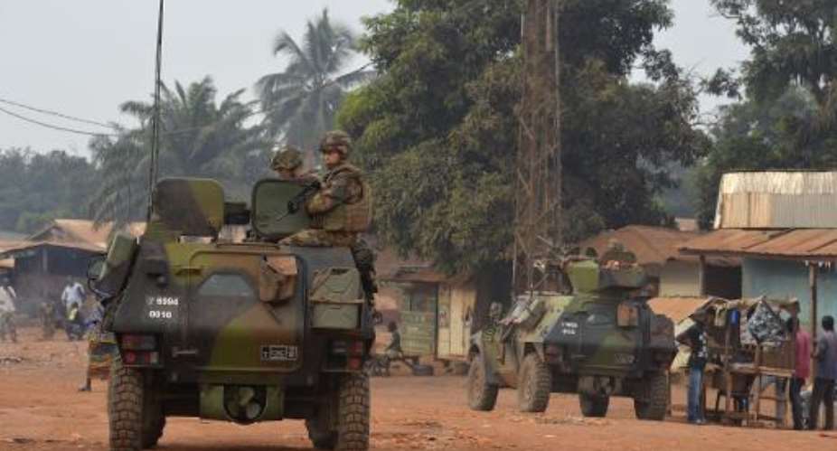 French soldiers patrol in the Yagato district of Bangui, Central African Republic, on December 26, 2013.  By Miguel Medina AFP