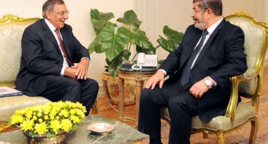 Egyptian President Mohamed Mursi (R) meets with US Defense Secretary Leon Panetta (L).  By  (AFP/EGYPTIAN PRESIDENCY)