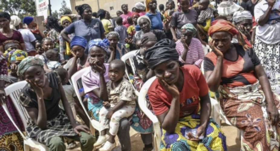 People displaced by the violence that erupted in central Nigeria, killing more than 100 people.  By - AFPFile